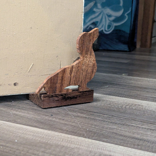 Handmade Koa wood doorstop in the shape of a dachshund. Custom carved and made to order