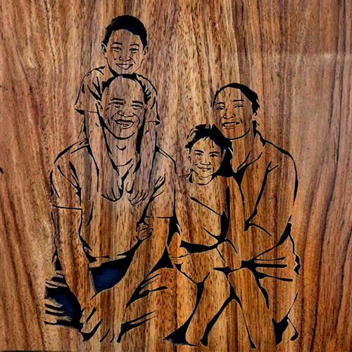 Custom wooden family portrait with 4 faces. Hand-carved from a photo, perfect for home decor or gifts