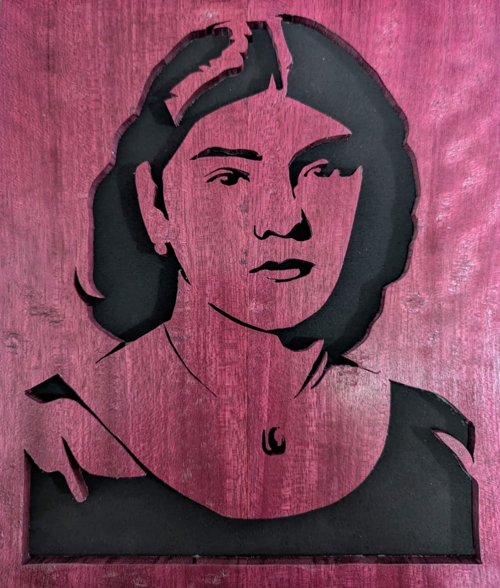 Handcrafted wooden portrait of an elderly man with glasses and cap, custom wood art.