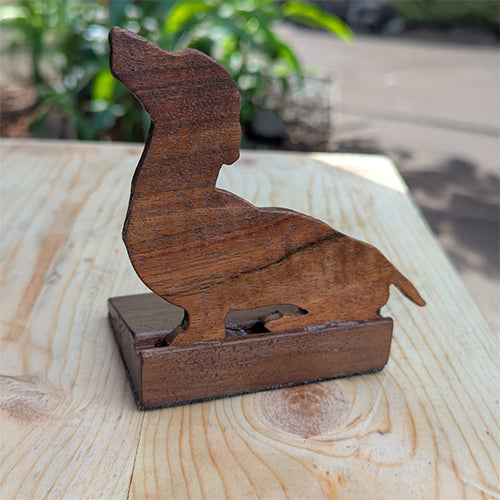 Handmade Koa wood doorstop in the shape of a dachshund. Custom carved and made to order