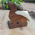 Handmade Koa wood doorstop in the shape of a dachshund. Custom carved and made to order