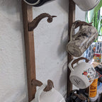 Hand-carved octopus tentacle mug holder made from walnut wood. Unique and functional art piece