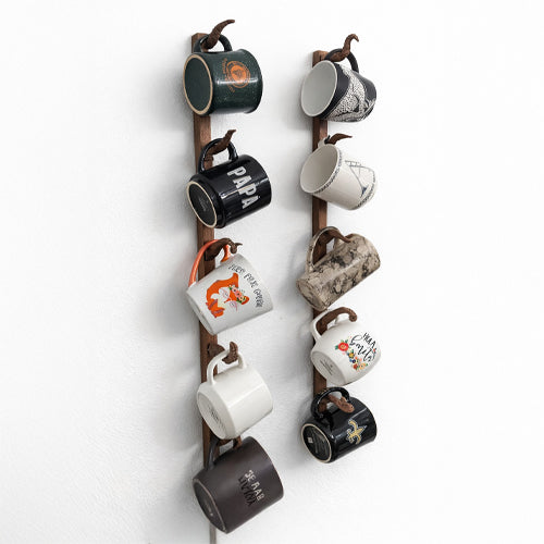 Hand-carved octopus tentacle mug holder made from walnut wood. Unique and functional art piece